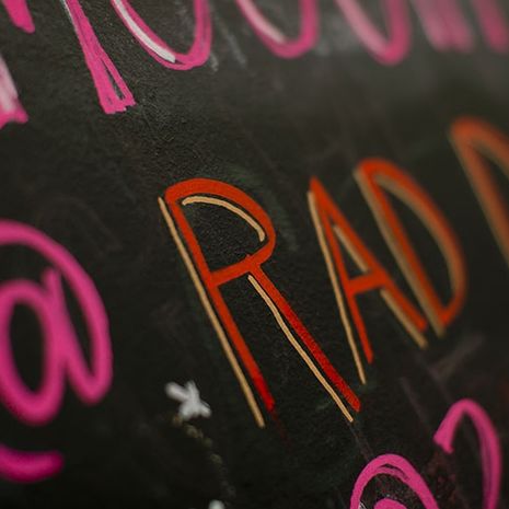 A chalkboard sign at Rad Dish Co-Op. 