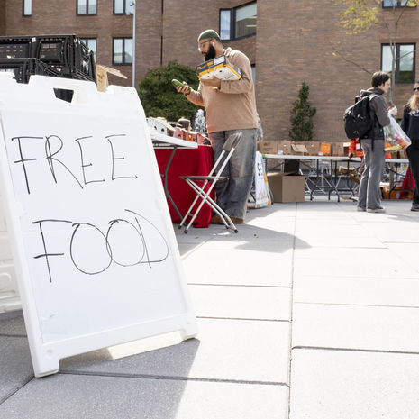 A sign at the World Food Day event reads FREE FOOD 