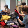 students sort through donated clothing during move-out