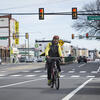 Faculty member riding a bike to work