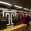 Student waiting for the Broad Street Line subway.
