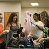 Volunteers sort through clothing donations