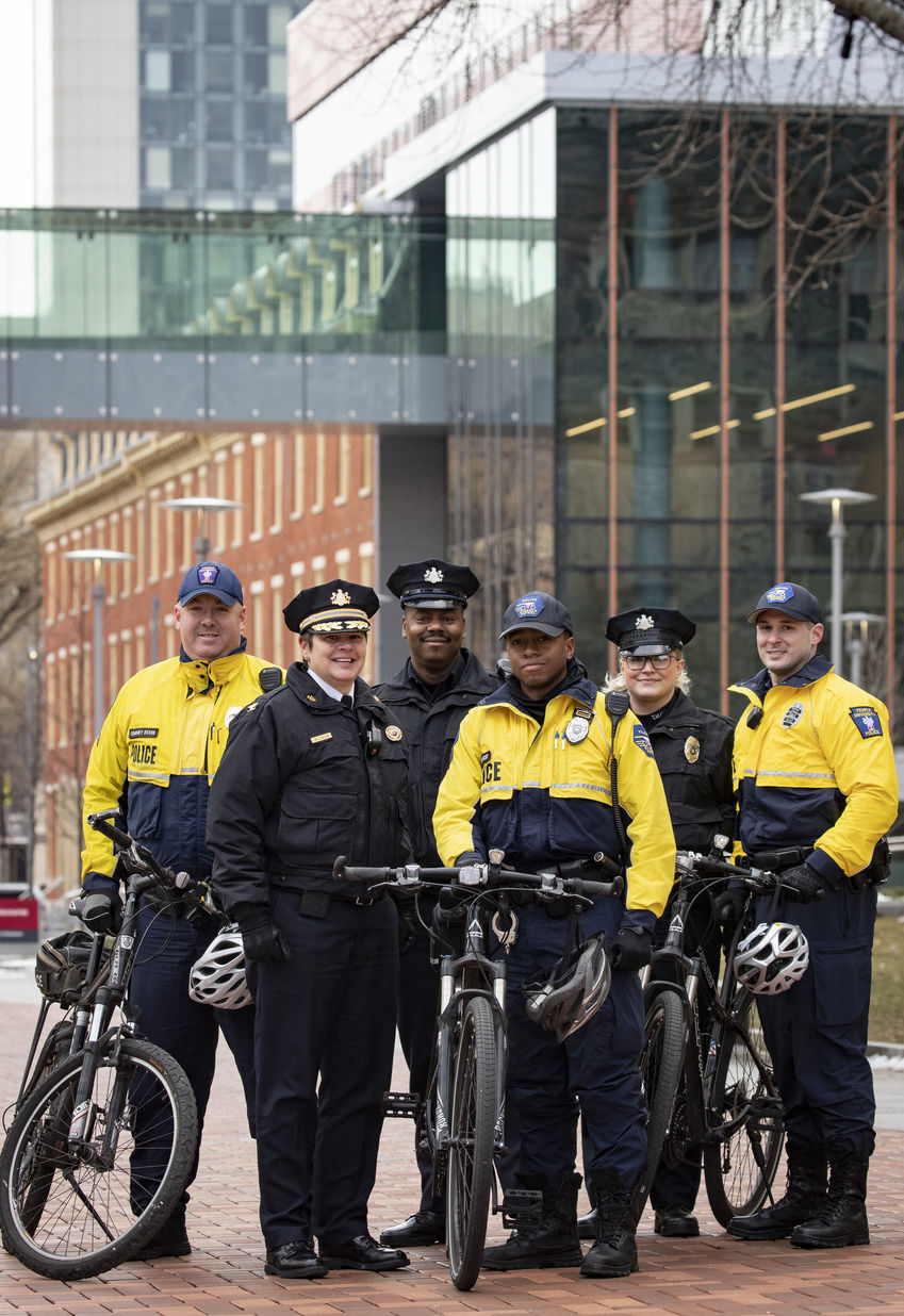 Temple Campus Safety standing with bicycles